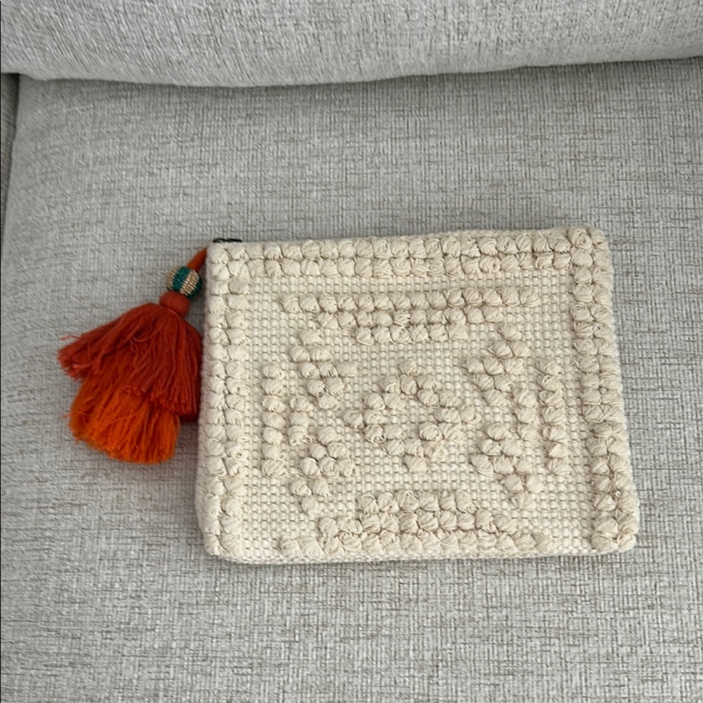 Universal Thread Cream Clutch with Orange Tassel